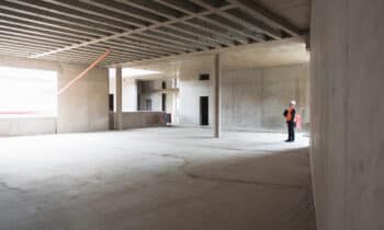 orig auditor inspecting building under construction Getty 7358