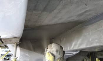 Application of carbonation inhibitor coating after concrete repairEN